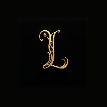 Black notebook cover with a fancy gold capital letter L