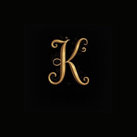 Black notebook cover with a fancy gold capital letter K